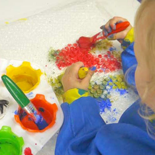 Bubble Wrap Dancing and Printing – Music and Art Activities for Toddlers