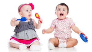 Infant Girls dressed up with instruments