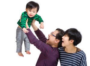 Happy baby boy with mum and dad