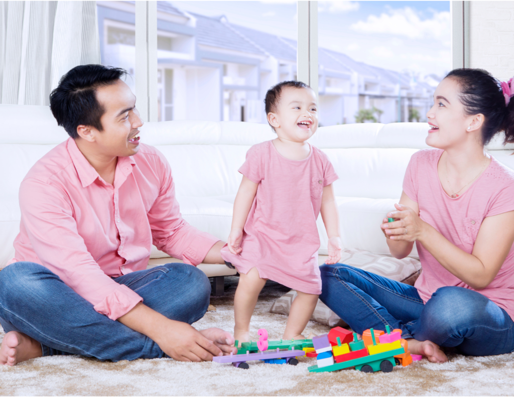Family listen and play with toddler